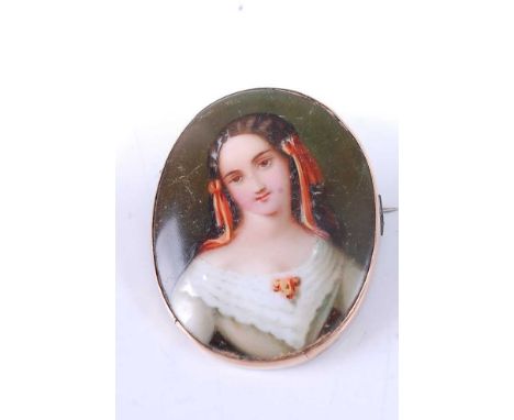 A continental porcelain miniature portrait brooch, depicting bust portrait of a maiden, in 9ct gold mount, 5 x 4cm 