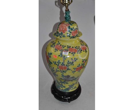 A Chinese yellow glazed jar and cover, of baluster form, converted into a table lamp, the lid with shishi finial, the body en