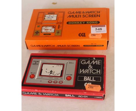 A boxed Nintendo Game &amp; Watch multi screen 'Donkey Kong' hand held game, battery operated, together with a similar Game &