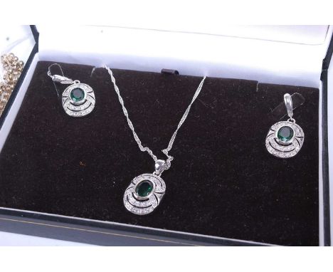 A white metal and paste set garniture, comprising pendant on finelink neck chain, and matching ear clips, in fitted case; tog