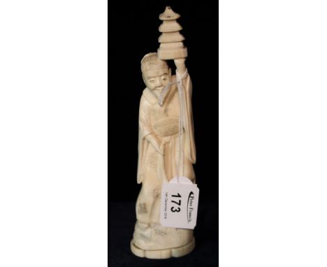 Early 20th Century Japanese Okimono type carved ivory figure of a deity holding lantern aloft.