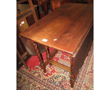 Early 20th Century oak barley twist gate legged table.