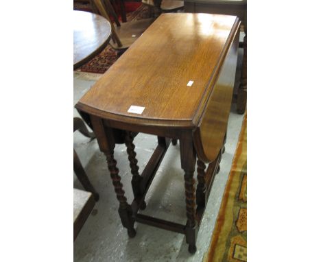 Early 20th Century oak barley twist gate legged table.