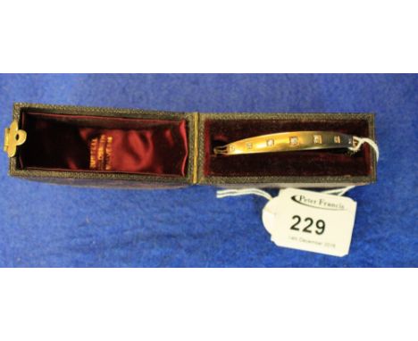 15ct gold, diamond chip and engraved bangle in original box. CONDITION REPORT: Weight - 9.4g