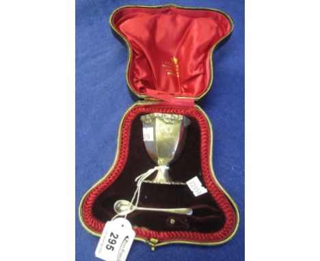 Cased silver hexagonal egg cup and spoon, London hallmarks.