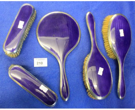 Five piece silver and purple enamel lady's vanity set comprising four brushes and mirror.   Chester hallmarks. (5) CONDITION 