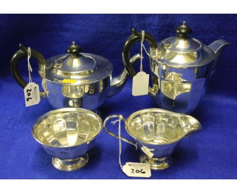 Silver four piece tea set comprising: teapot; water jug; cream jug and sugar bowl of pedestal, circular form, Sheffield hallm