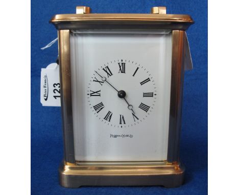 Mappin and Webb Limited brass carriage clock, having gorge case and full depth face with Roman numerals.  With key.