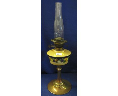 20th Century double burner oil lamp with fruit decorated reservoir.