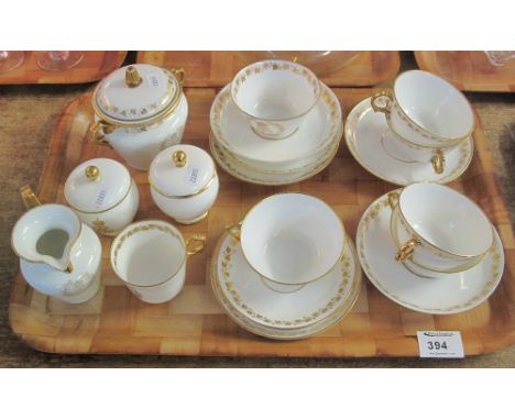 Tray of Sevres, Chateau de St. Cloud porcelain teaware items on a white ground with gilt banding and ivy decoration with mono