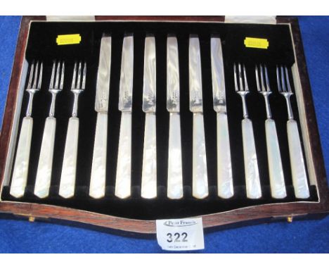 Cased set of silver and mother-of-pearl handled pickle knives and forks.