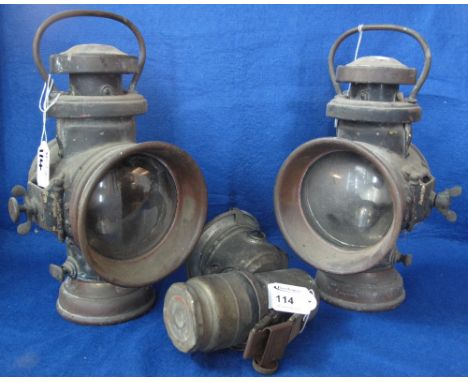 Pair of Howes and Burley Ltd. of Birmingham vehicle lamps together with a Lucas acetylene bicycle or motorcycle lamp.  Early 