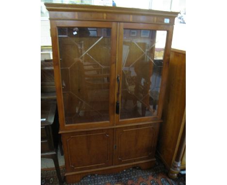 Reproduction yew wood display cabinet on bracket feet. CONDITION REPORT: No obvious damage for age.