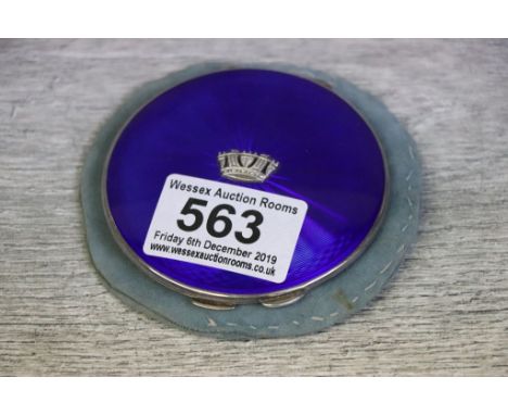 Enamelled silver compact, the royal blue guilloche enamelled lid with cast Merchant Navy symbol to centre, engine turned base