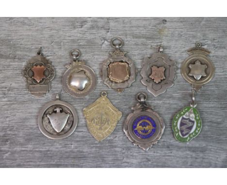 Nine silver fob medallions to include blank cartouches, enamelled Western Time Trials fob, Bagatelle League fob etc (9)
