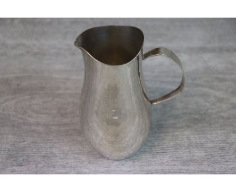 Graham Watling silver milk jug, the hammered body of baluster form, hallmarked London 1974, height approximately 13cm