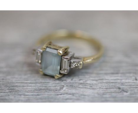 Aquamarine and diamond 9ct yellow gold white gold set ring, the rectangular step cut aquamarine measuring approximately 8mm x