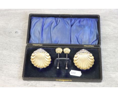 Early twentieth century cased set of silver parcel gilt salts modelled as a pair of scallop shells with a pair of matching sa