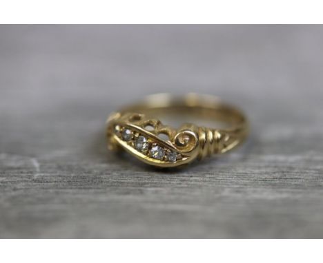 Early 20th century diamond five stone 18ct yellow gold ring, five graduated round eight cut diamonds set to scrolled mount, b