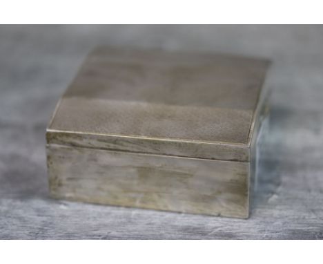 Geroge V silver cigarette box of square form with engine turned hinged lid, makers Barker Brothers Silver Ltd, Birmingham 193