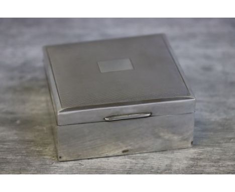 Silver cigarette box, square form, plain polished body with hinged engine turned lid, blank cartouche, makers Poston Products