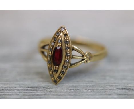 Victorian garnet and diamond 18ct yellow gold marquise ring, the central oval mixed cut garnet with nineteen small rose cut d