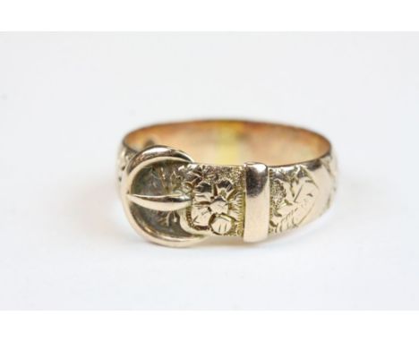 Late Victorian 9ct rose gold buckle ring, the band with floral decoration in relief, band width at widest point approximately