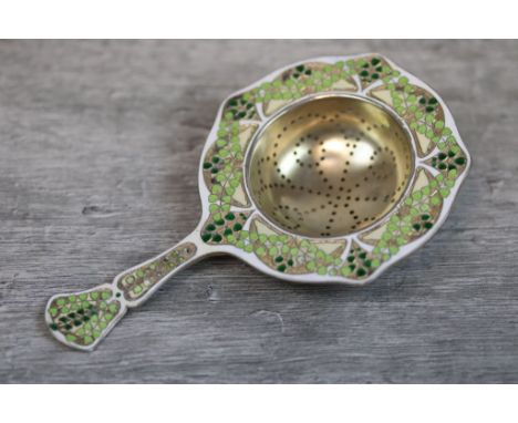Marius Hammer Norwegian enamelled silver gilt tea strainer, with enamelled trailing leaf decoration, flared handle, length ap