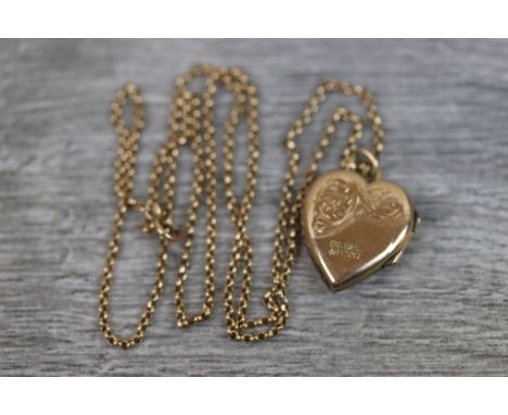 9ct yellow gold front and back heart shaped locket, engraved foliate scroll decoration, on 9ct yellow gold chain, length of c