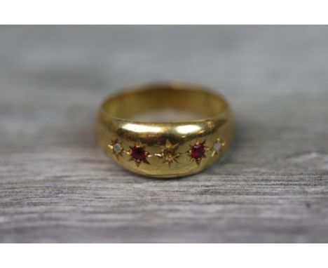 Ruby and diamond 18ct yellow gold gypsy ring, two small round mixed cut rubies and two small rose cut diamonds, the central s