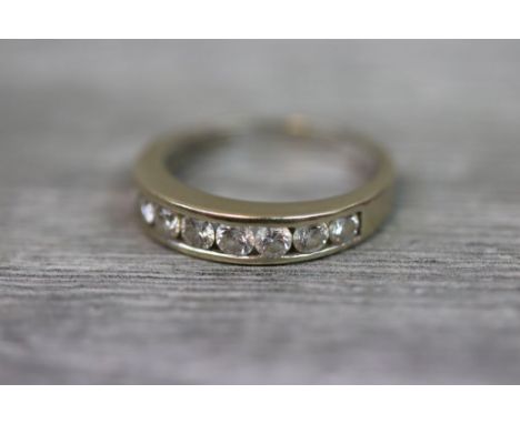 Diamond 18ct white gold half eternity ring, comprising nine round brilliant cut diamonds, channel settings, stated diamond we