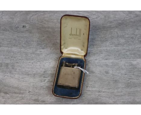 George VI Dunhill silver cigarette lighter, the square body with engine turned decoration, signed hinged and sprung dowsing c