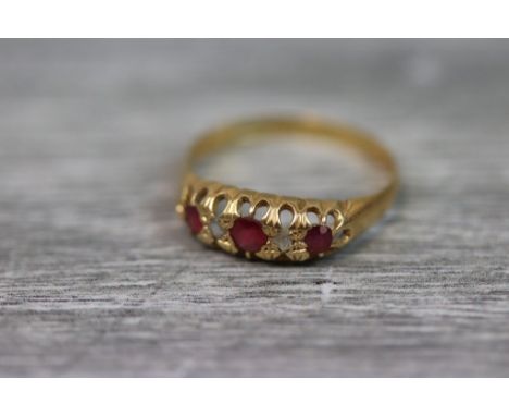 Early 20th century ruby and diamond 18ct yellow gold boat head ring, three graduated small round mixed cut rubies with two sm