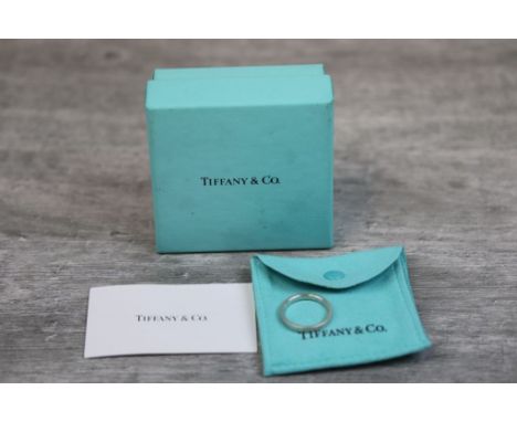 Tiffany &amp; Co silver 'I love you' eternity ring, band width approximately 3mm, ring size P½, complete with pouch and box