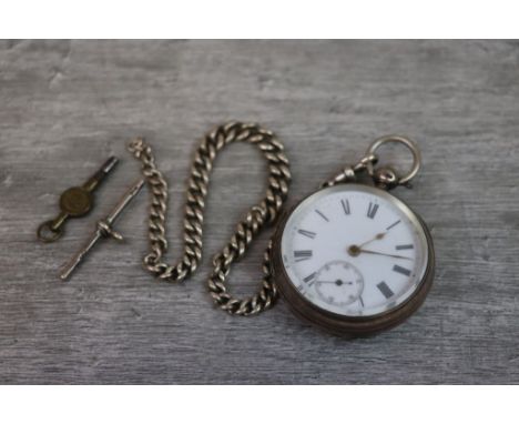 Victorian silver open face key wind pocket watch, white enamel dial and subsidiary dial, black Roman numerals, blank shield s