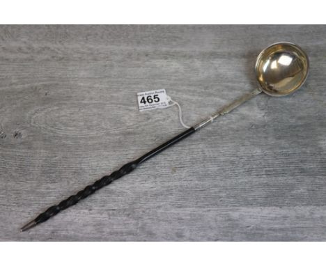 18th/ 19th century continental silver toddy ladle with barley twist baleen handle, silver finial, the reverse bowl with engra