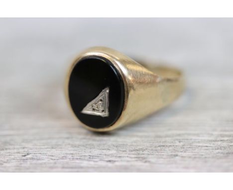 Diamond onyx 9ct yellow gold signet ring, small round rose cut diamond, illusion set to triangular panel to oval black onyx, 