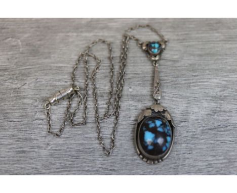 Turquoise unmarked silver Arts and Crafts style pendant necklace, the principle oval cabochon cut turquoise measuring approxi