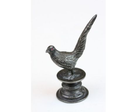 Edwardian silver seal modelled as a pheasant with ruby eyes, textured body, stood on plinth, engraved initial H below a Crown