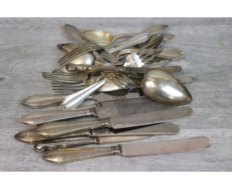 Silver flatware to include six silver handled knives, five silver forks, six silver teaspoons and one silver serving spoon, a