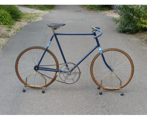 A Peugeot Pacing Bicycle.  Possessing a 25-inch semi-lightweight frame with blended lugs, finished in dark blue with light bl
