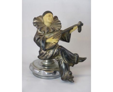 Pierrot  playing his mandolin to the moon, pining for love of Columbine. A pantomime clown from the French  series of charact