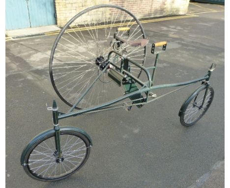 A Reproduction Rudge Rotary Tricycle, having a 48-inch driving wheel, 20-inch pneumatic steering wheels, hand-controlled disc