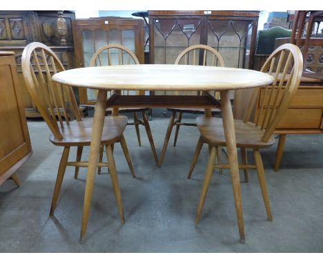 An Ercol table and four chairs