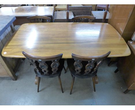 An Ercol refectory table and four chairs