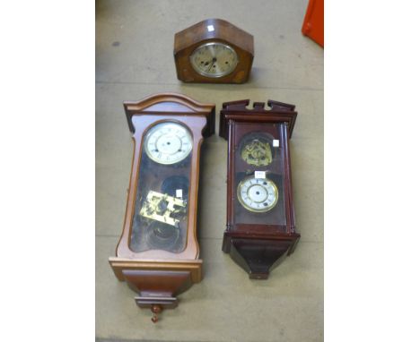 Two wall clocks and a mantel clock
