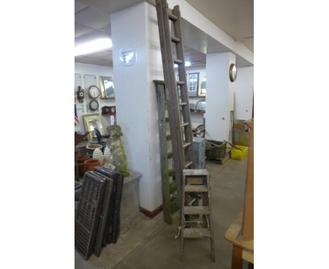 Two stepladders and an extending ladder