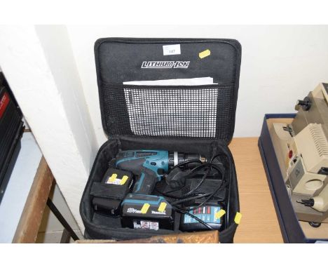 Cased Makita electric drill and accessories