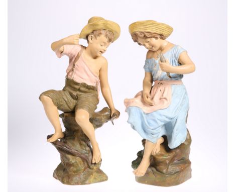 A PAIR OF GOLDSCHEIDER TERRACOTTA FIGURES, LATE 19TH CENTURY,&nbsp;modelled as a boy and girl catching fish, impressed and mo