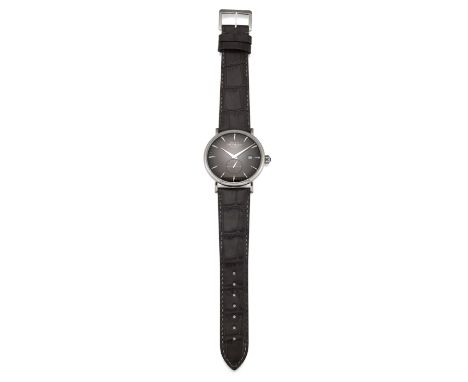 A GENTS STEEL MICHEL HERBELIN STRAP WATCH. Circular black dial with baton index and silver hands, date aperture at 3 o'clock 